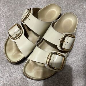 Cream Birkenstocks with Gold Buckles